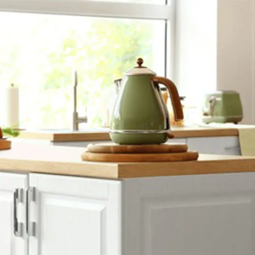 Electric kettle on wooden countertop in modern kitchen